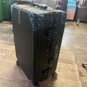 Black Hard Shell Rolling Suitcase